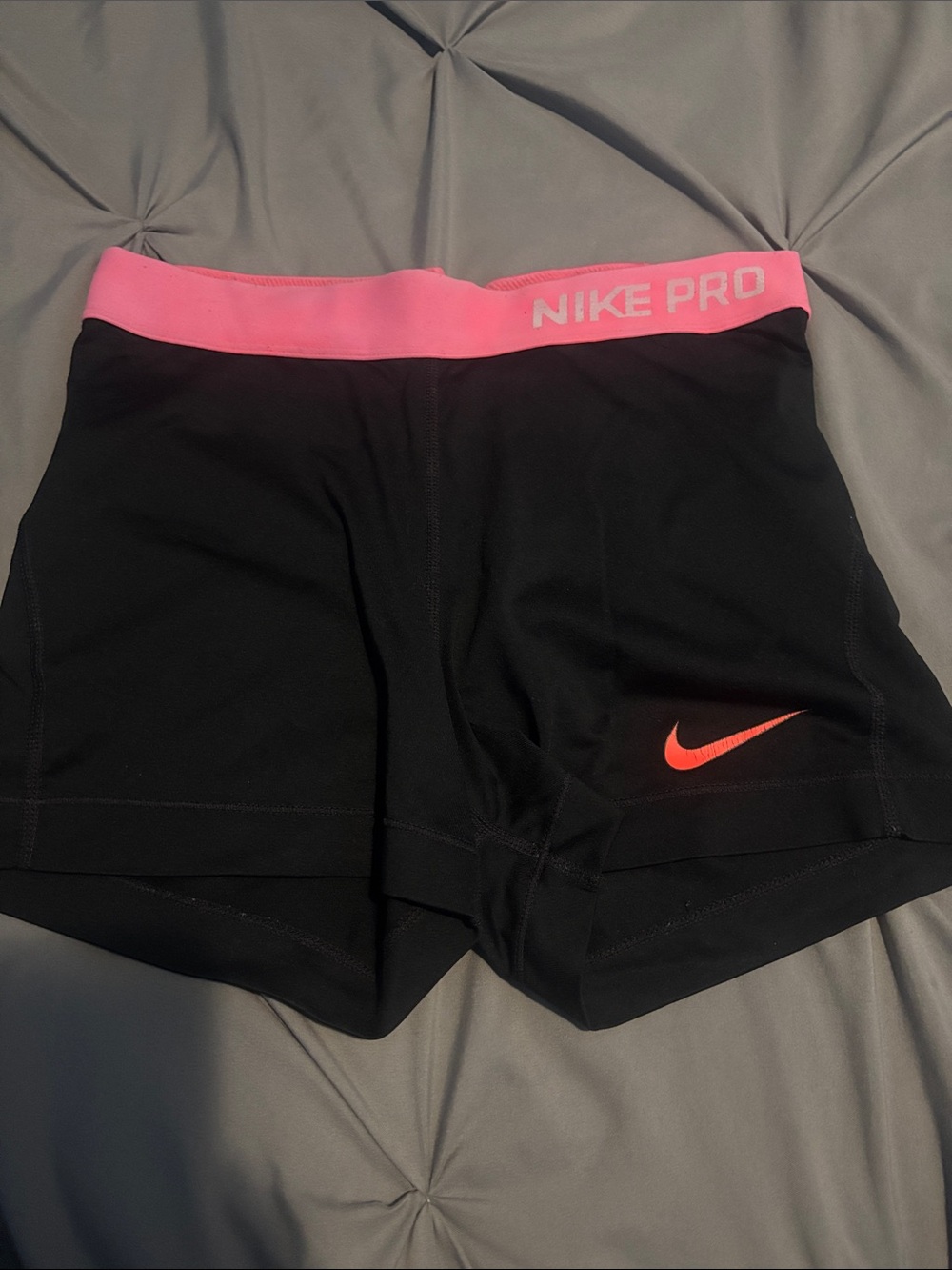 Nike Pro Black Athletic Shorts with Pink Waistband and Coral Swoosh